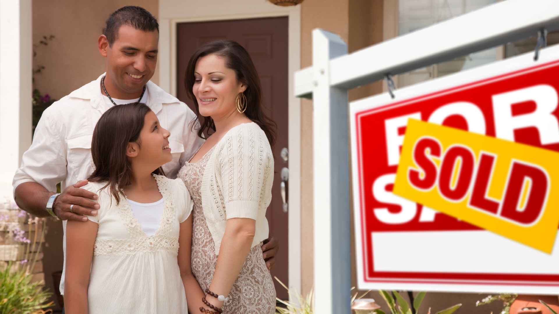 Hispanic family buying a home
