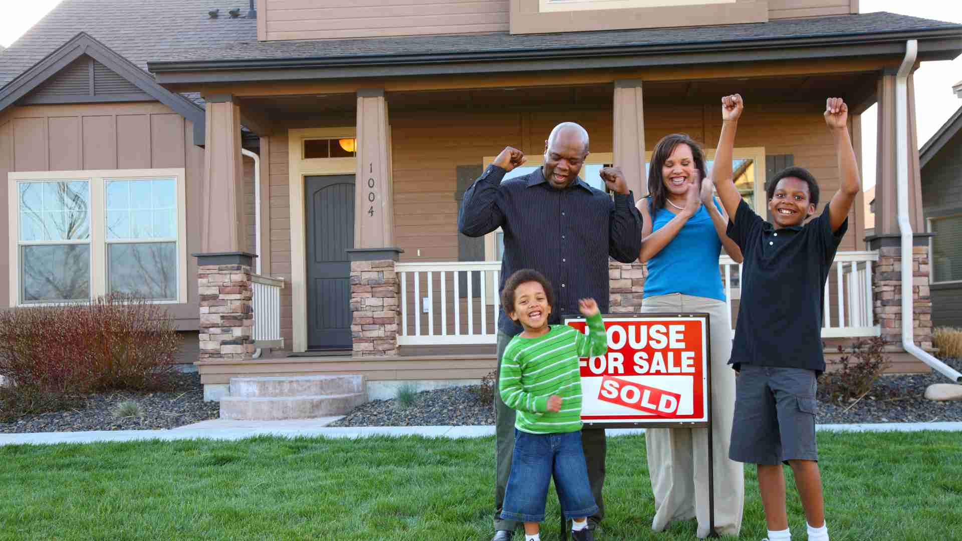 black family celebrate buying a home