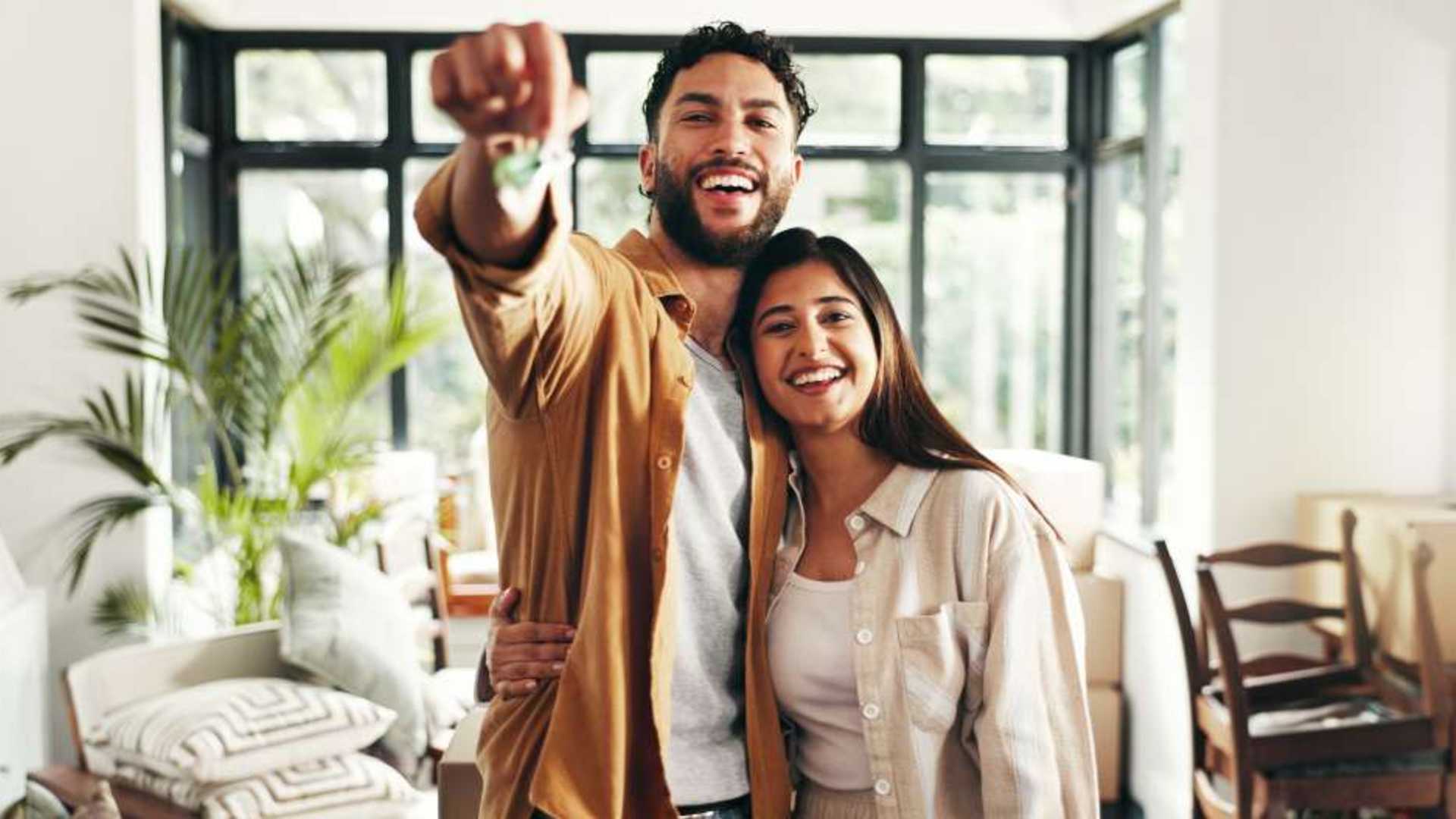 Happy new homeowners who were able to successfully close on a mortgage